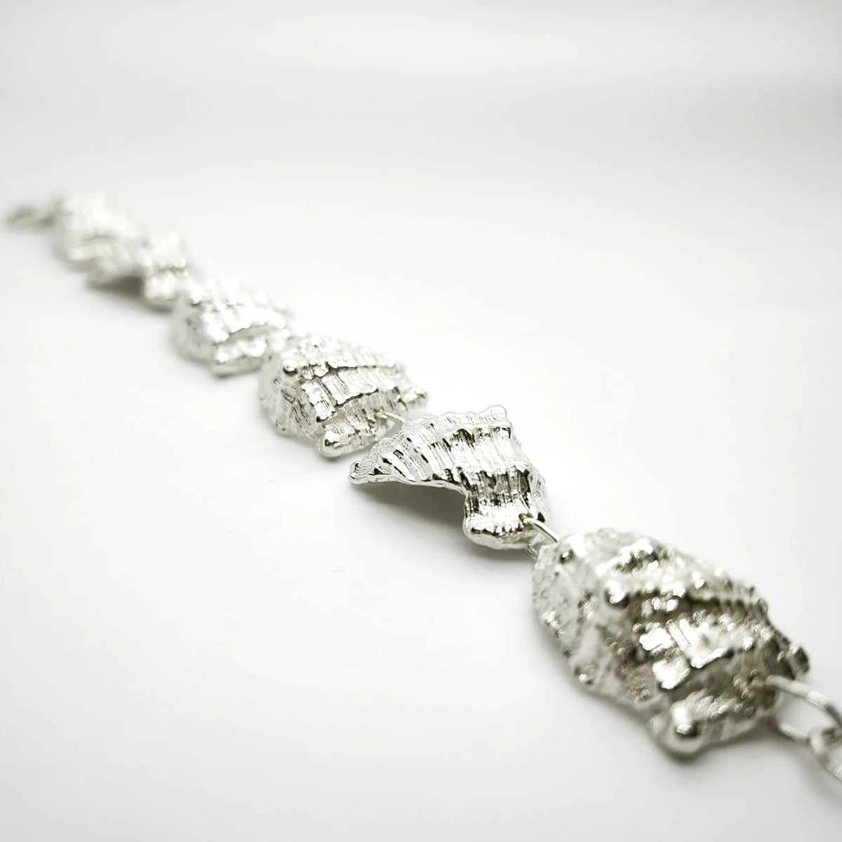 925 sterling silver bracelet with the texture from a conch shell. Design by Inês Almeida