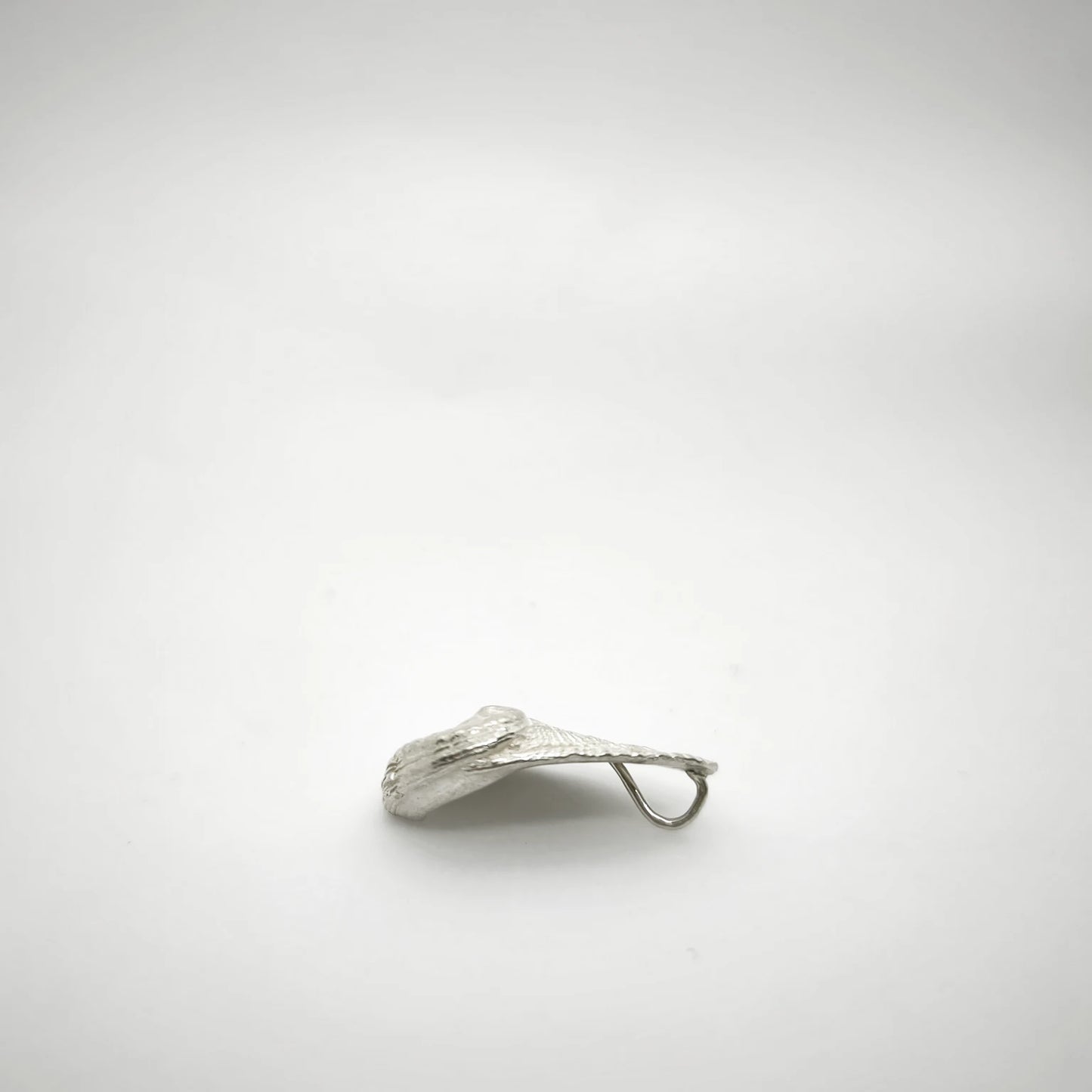 925 sterling silver pendent with the texture from a Fragment of an abalone. Design by Inês Almeida