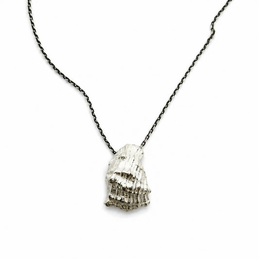 925 sterling silver pendant with the texture from a conch shell. Design by Inês Almeida