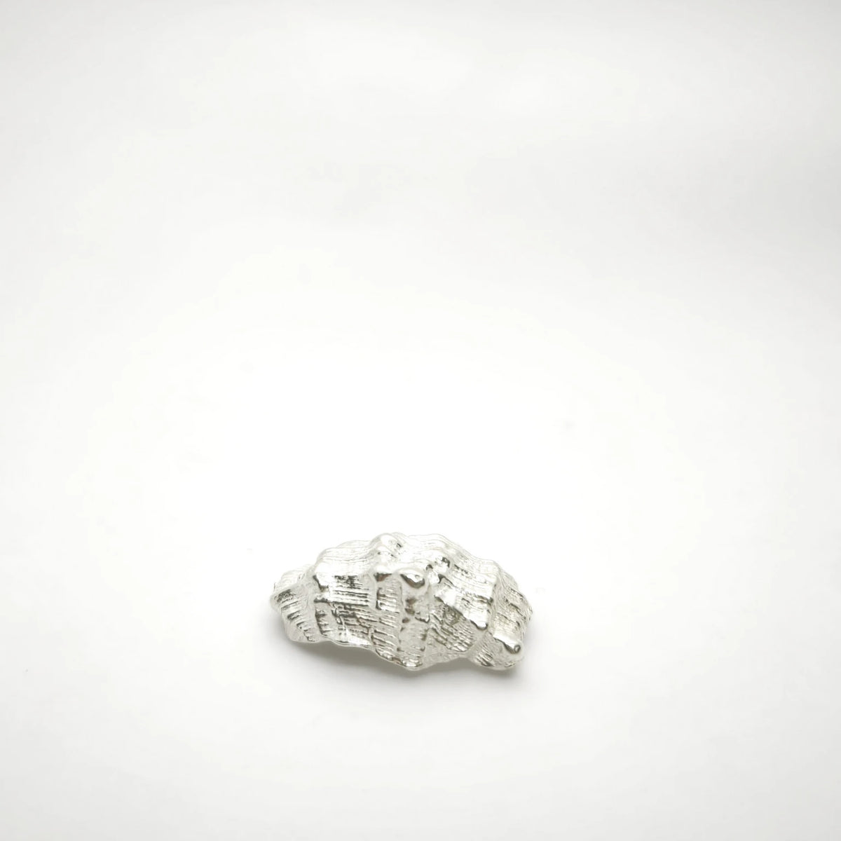 925 sterling silver pendant with the texture from a conch shell. Design by Inês Almeida
