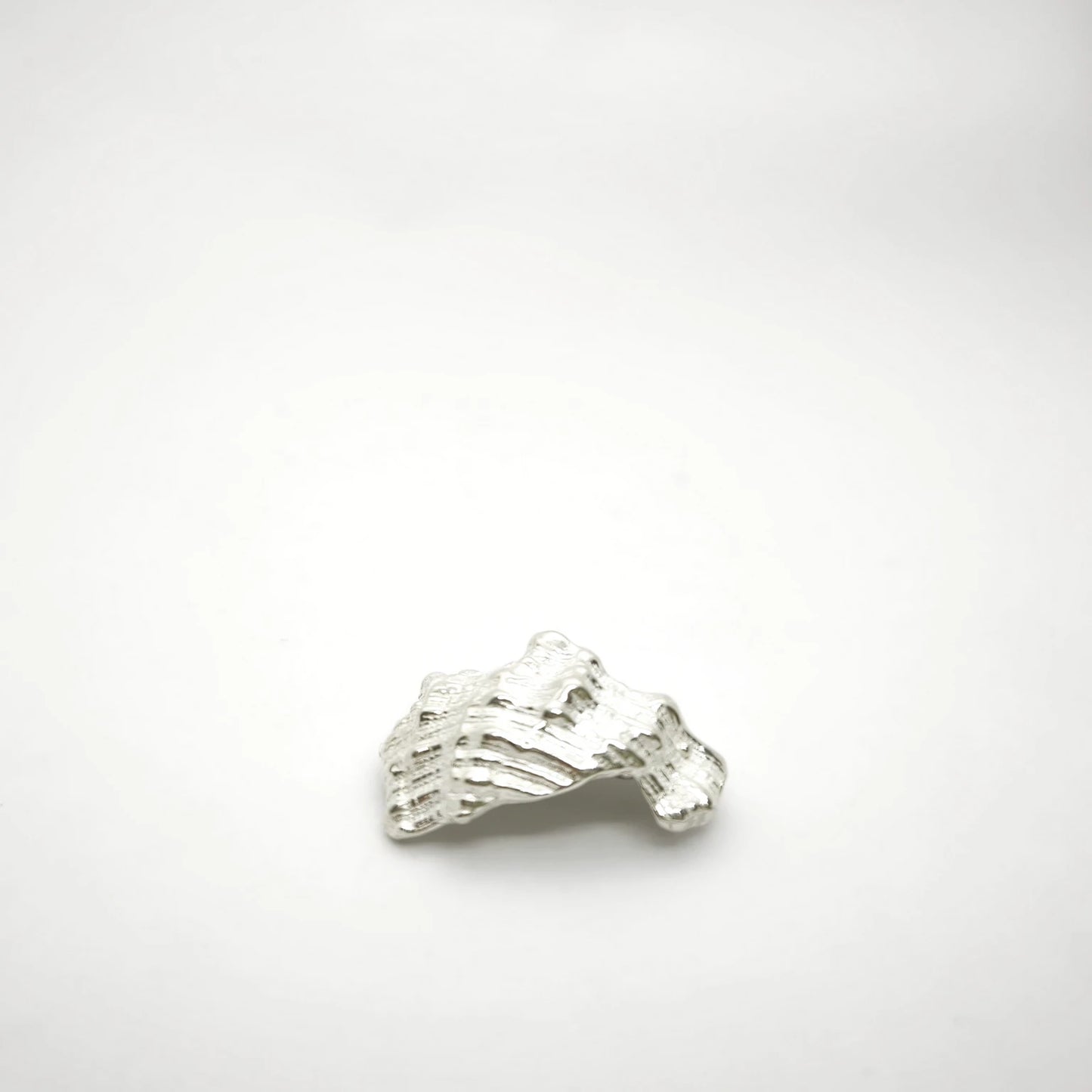 925 sterling silver pendant with the texture from a conch shell. Design by Inês Almeida