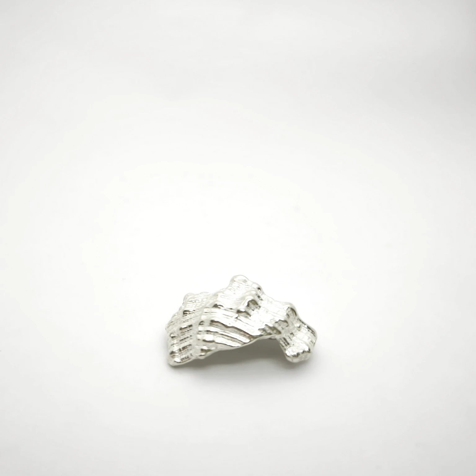 925 sterling silver pendant with the texture from a conch shell. Design by Inês Almeida