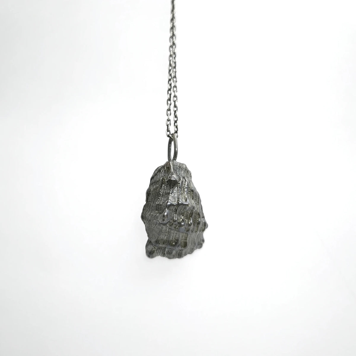 925 sterling silver oxidised pendant with the texture from a conch shell. Design by Inês Almeida