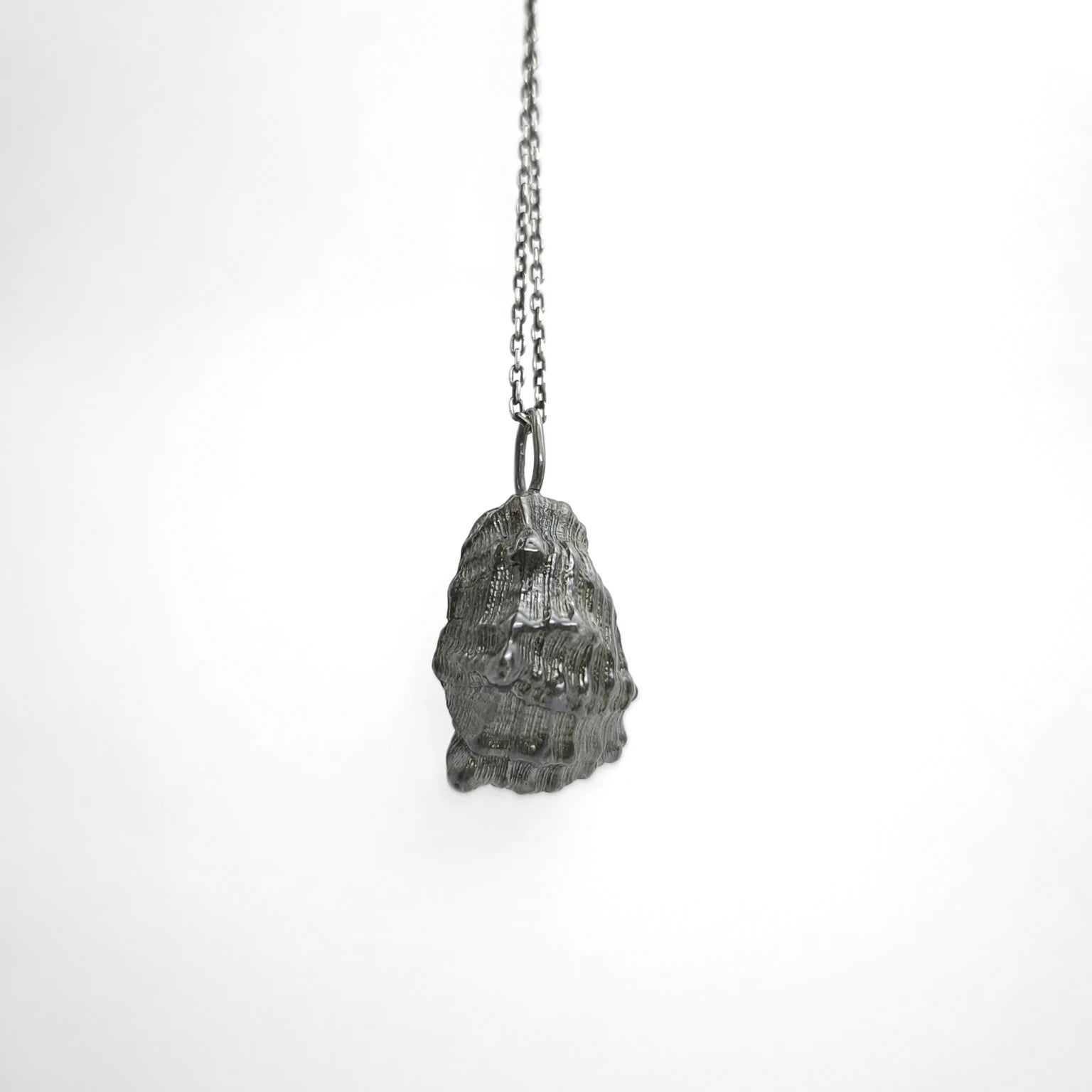 925 sterling silver oxidised pendant with the texture from a conch shell. Design by Inês Almeida
