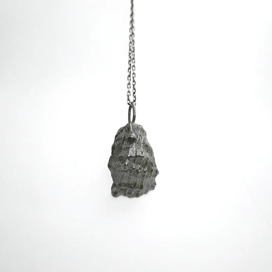 925 sterling silver oxidised pendant with the texture from a conch shell. Design by Inês Almeida