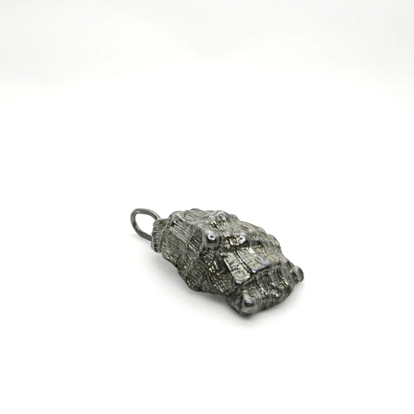 925 sterling silver oxidised pendant with the texture from a conch shell. Design by Inês Almeida