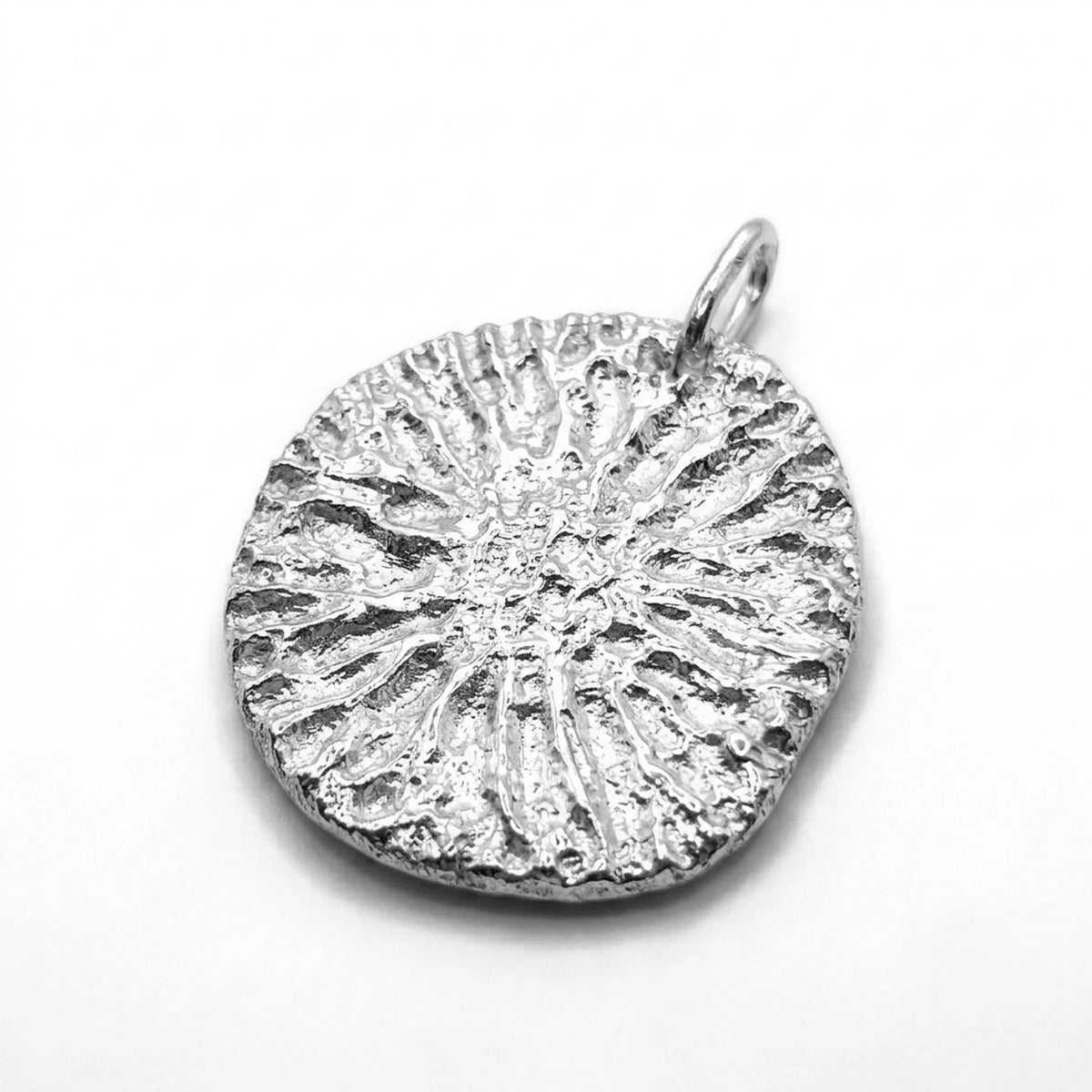 925 sterling silver pendant with the texture from a dolphin spine bone. Design by Inês Almeida.