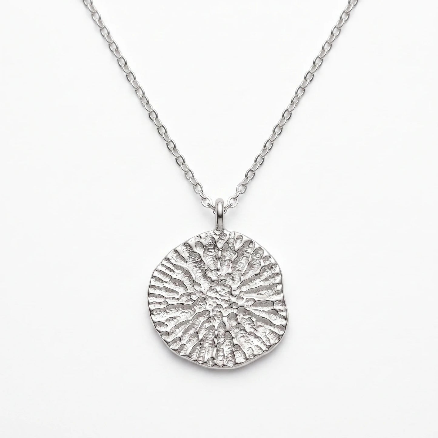 925 sterling silver pendant with the texture from a dolphin spine bone. Design by Inês Almeida.