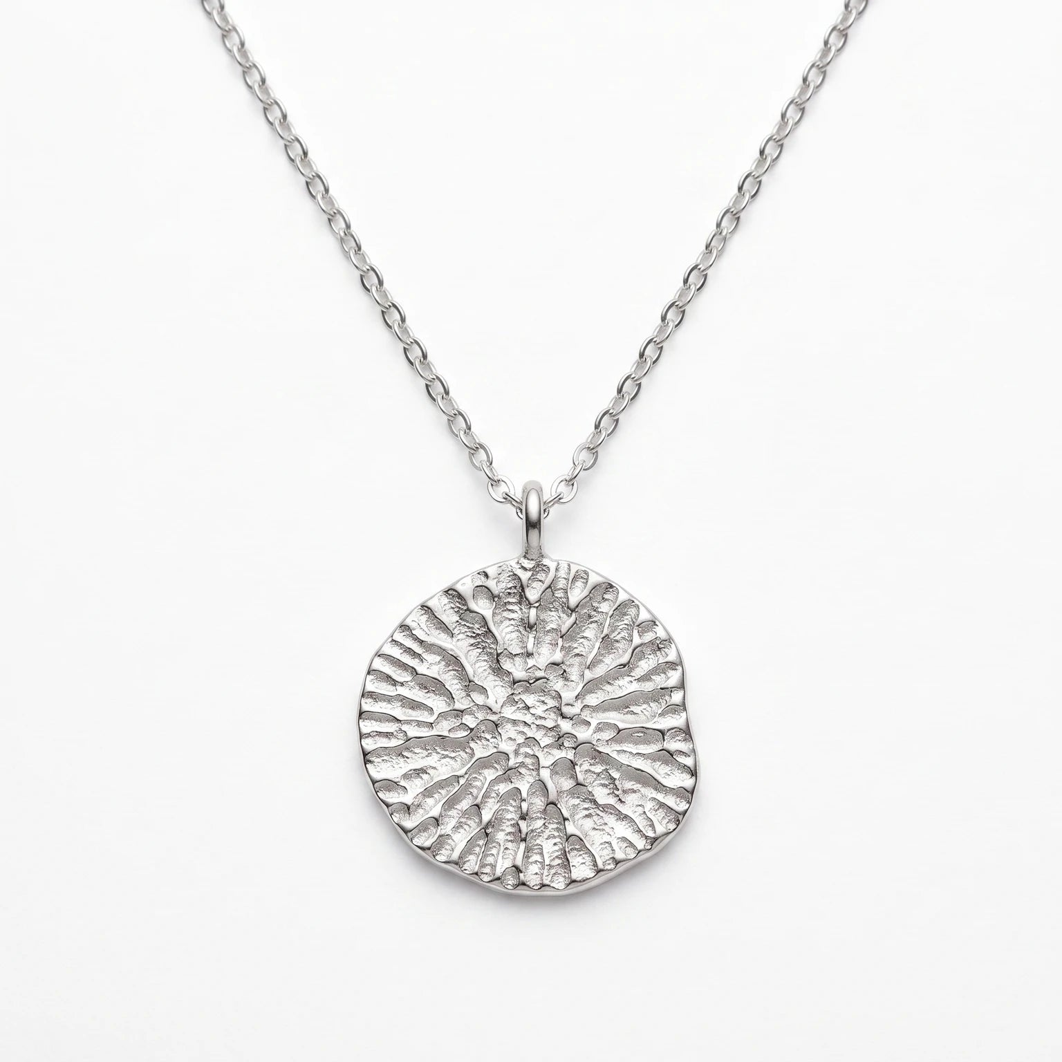 925 sterling silver pendant with the texture from a dolphin spine bone. Design by Inês Almeida.