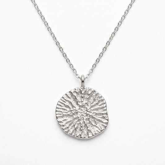 925 sterling silver pendant with the texture from a dolphin spine bone. Design by Inês Almeida.