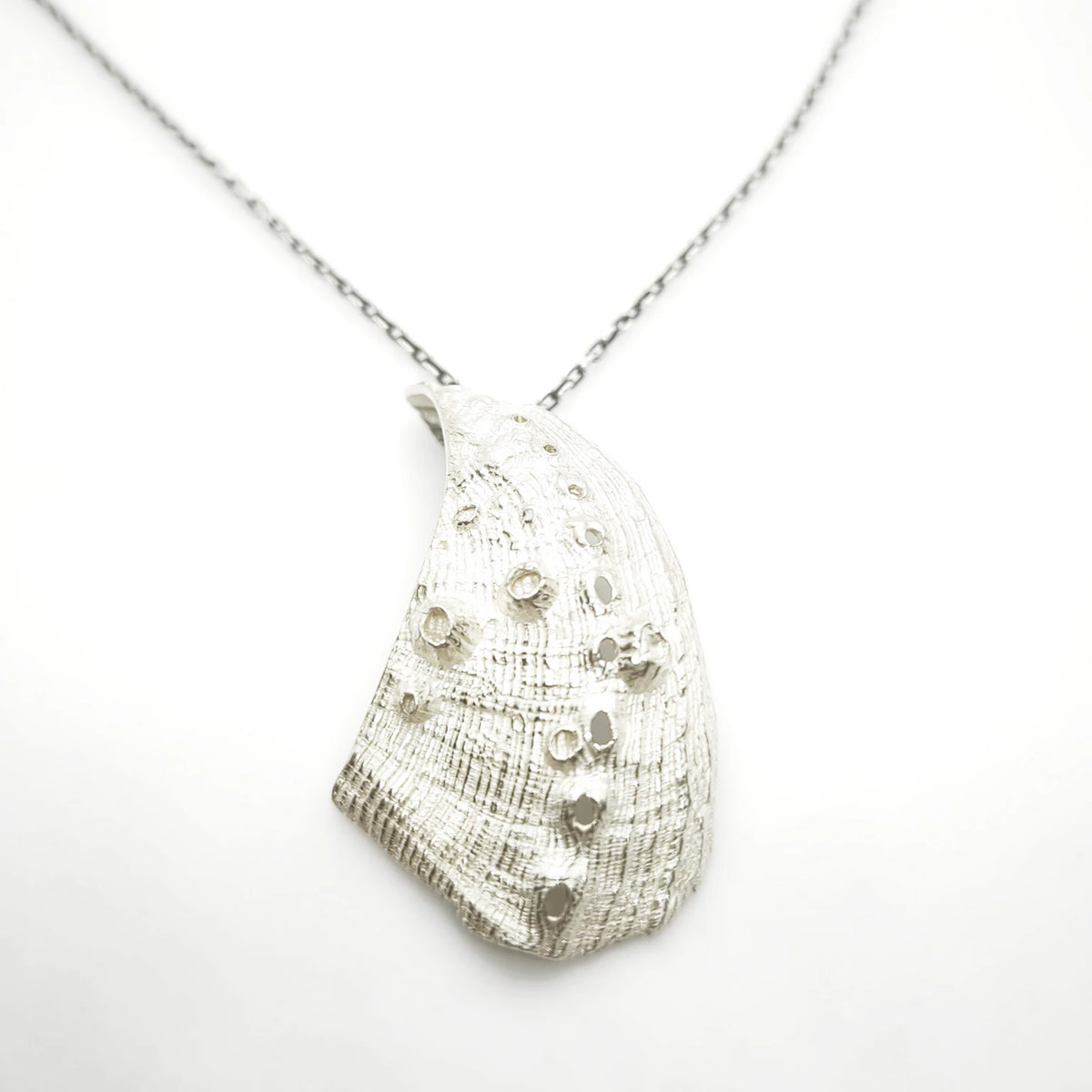 925 sterling silver pendent with the texture from a Fragment of an abalone. Design by Inês Almeida