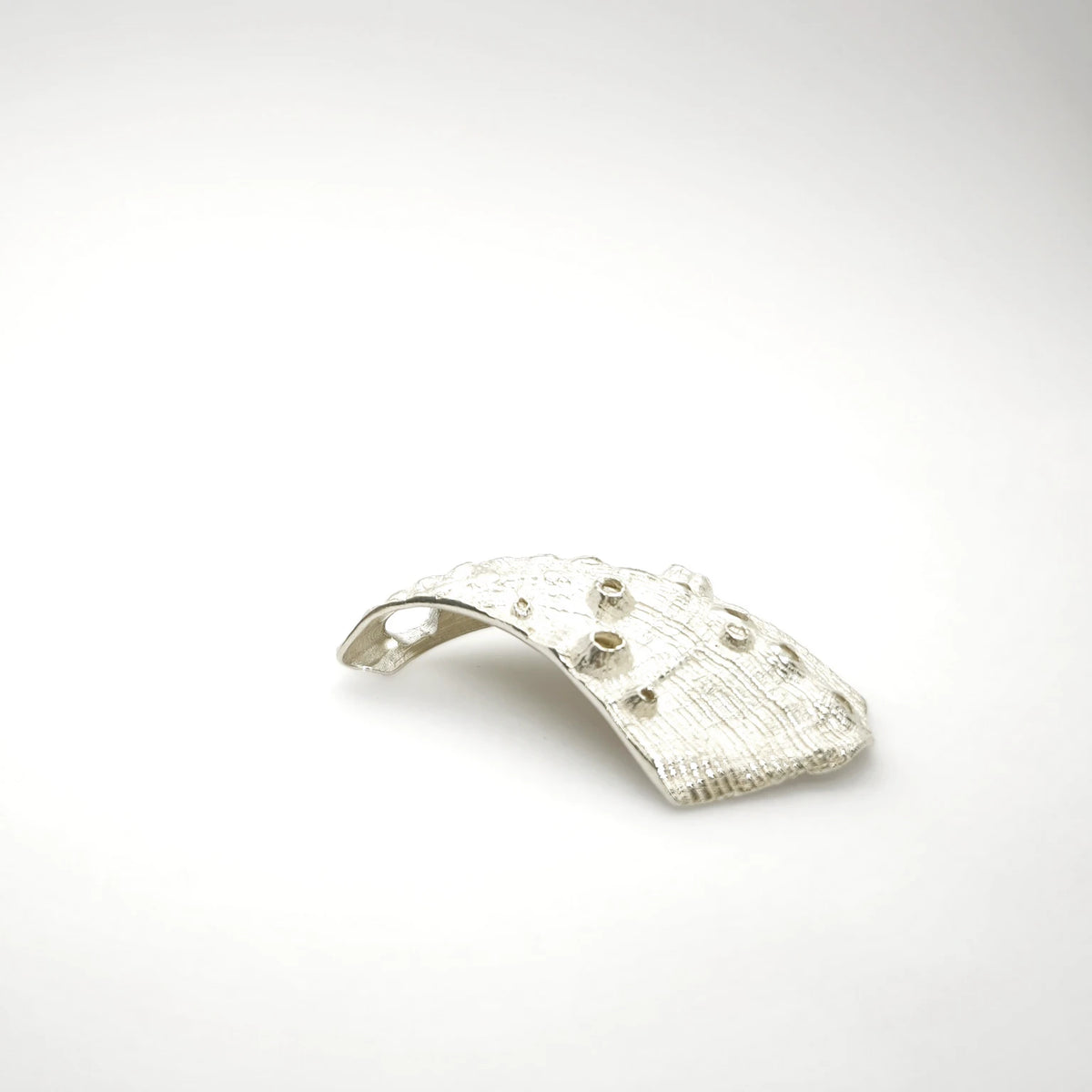 925 sterling silver pendent with the texture from a Fragment of an abalone. Design by Inês Almeida