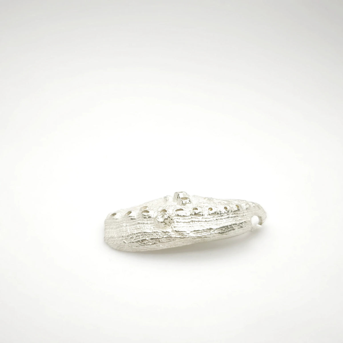 925 sterling silver pendent with the texture from a Fragment of an abalone. Design by Inês Almeida
