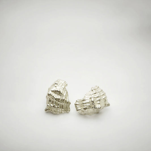 925 sterling silver earrings with the texture from a conch shell. Design by Inês Almeida
