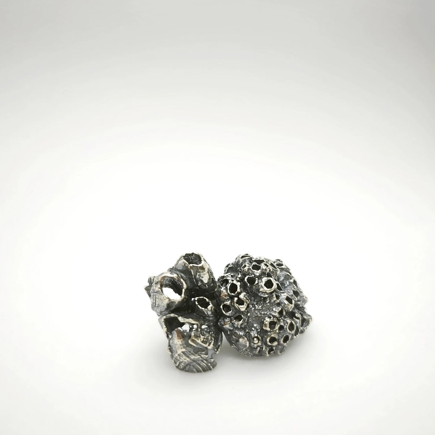 925 sterling oxidised silver brooch with the texture from a barnacle. Design by Inês Almeida