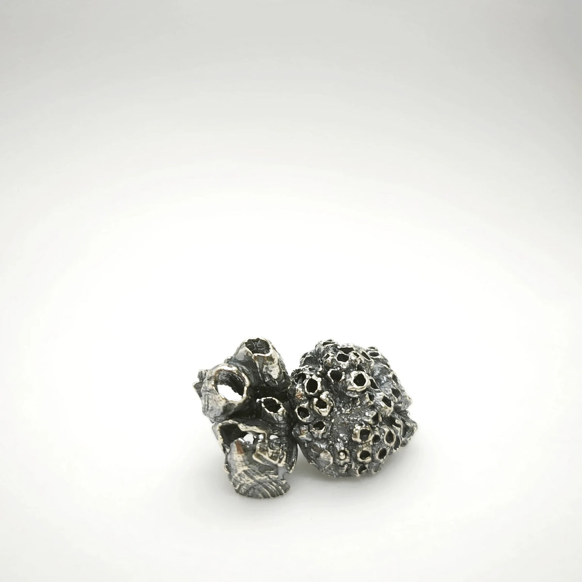 925 sterling oxidised silver brooch with the texture from a barnacle. Design by Inês Almeida
