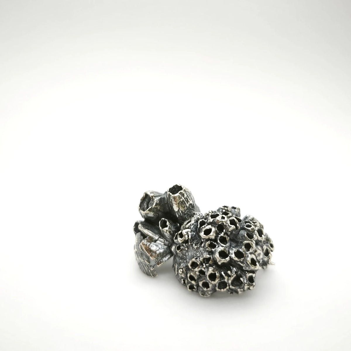 925 sterling oxidised silver brooch with the texture from a barnacle. Design by Inês Almeida