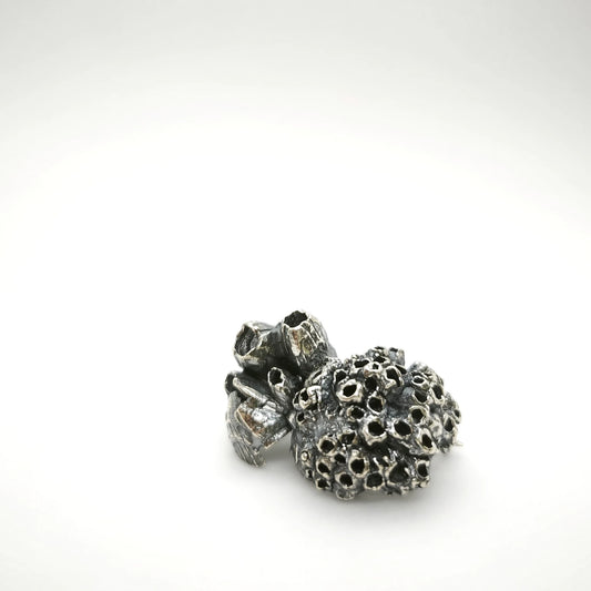 925 sterling oxidised silver brooch with the texture from a barnacle. Design by Inês Almeida