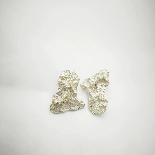 925 sterling silver earrings with the texture from an algae. Design by Inês Almeida