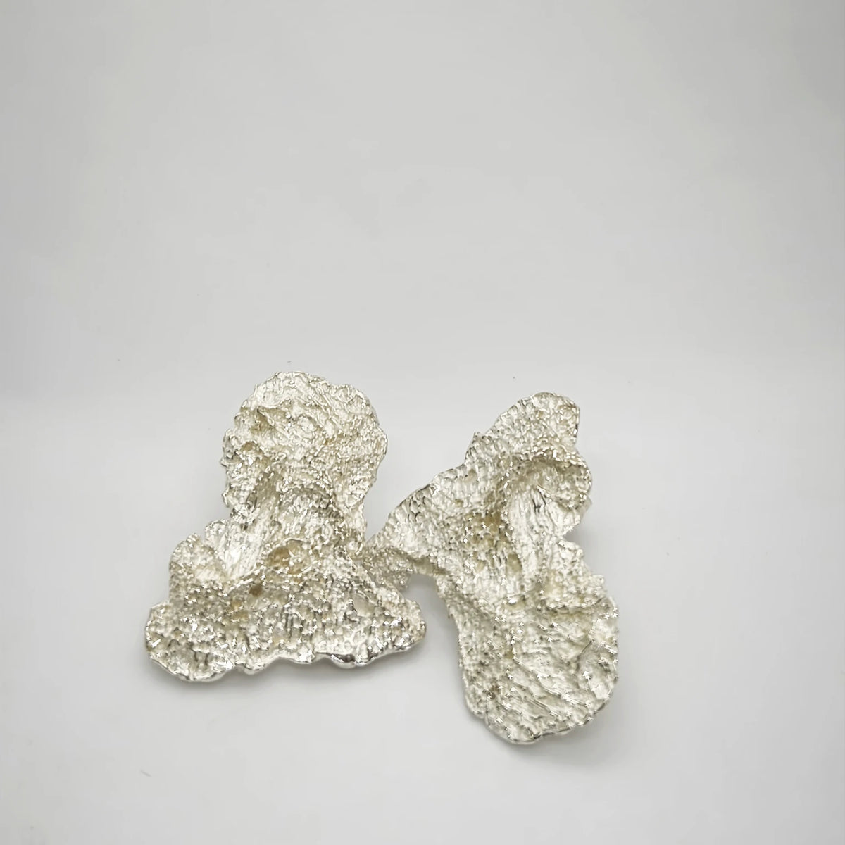 925 sterling silver earrings with the texture from an algae. Design by Inês Almeida