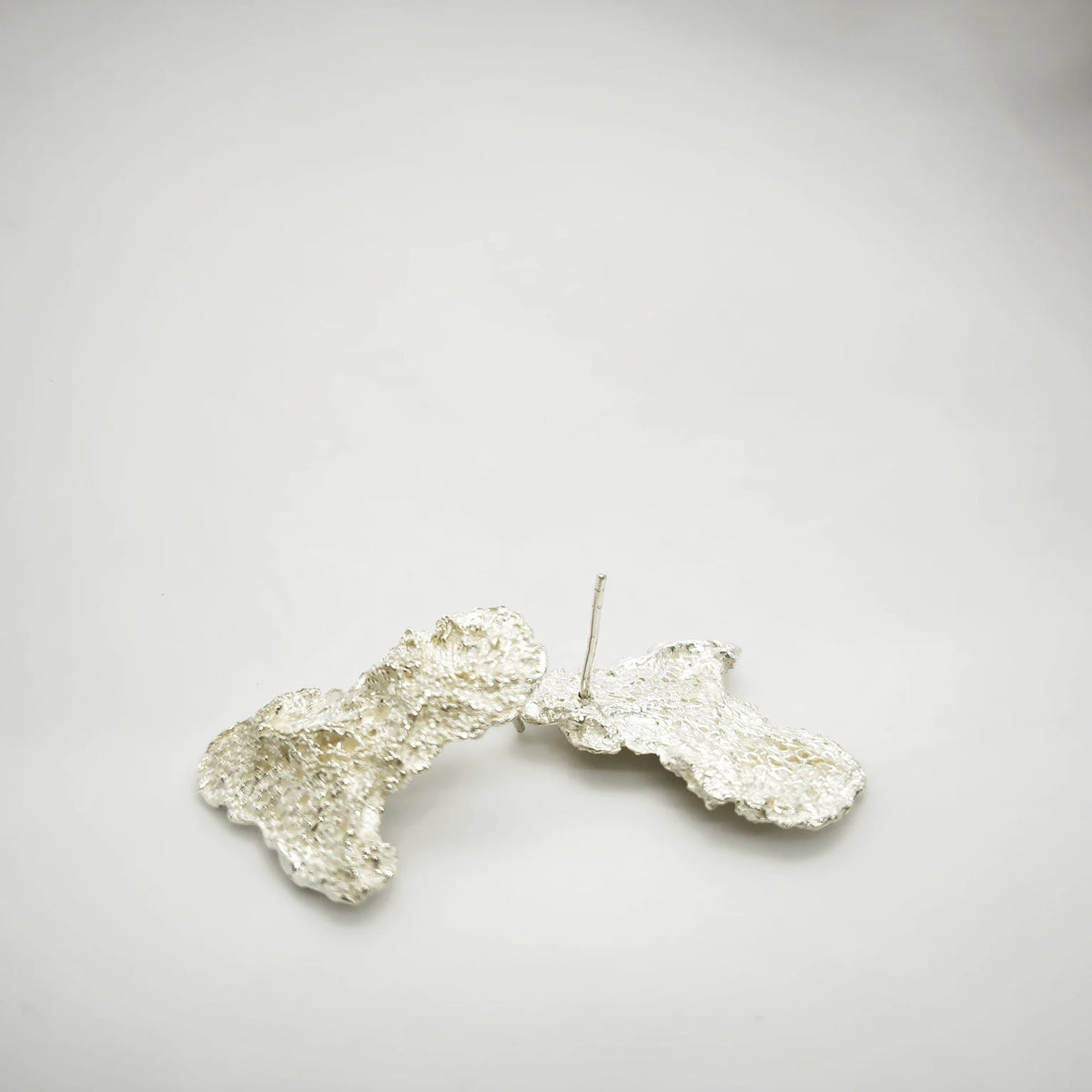 925 sterling silver earrings with the texture from an algae. Design by Inês Almeida