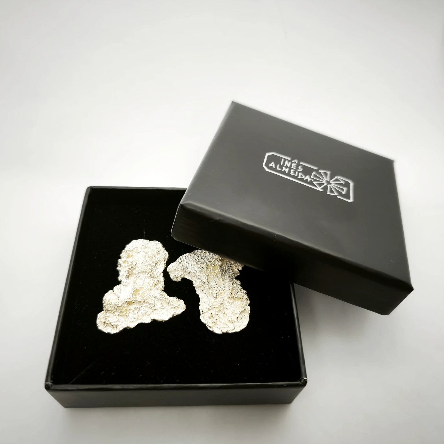 925 sterling silver earrings with the texture from an algae in a back jewellery box. Design by Inês Almeida