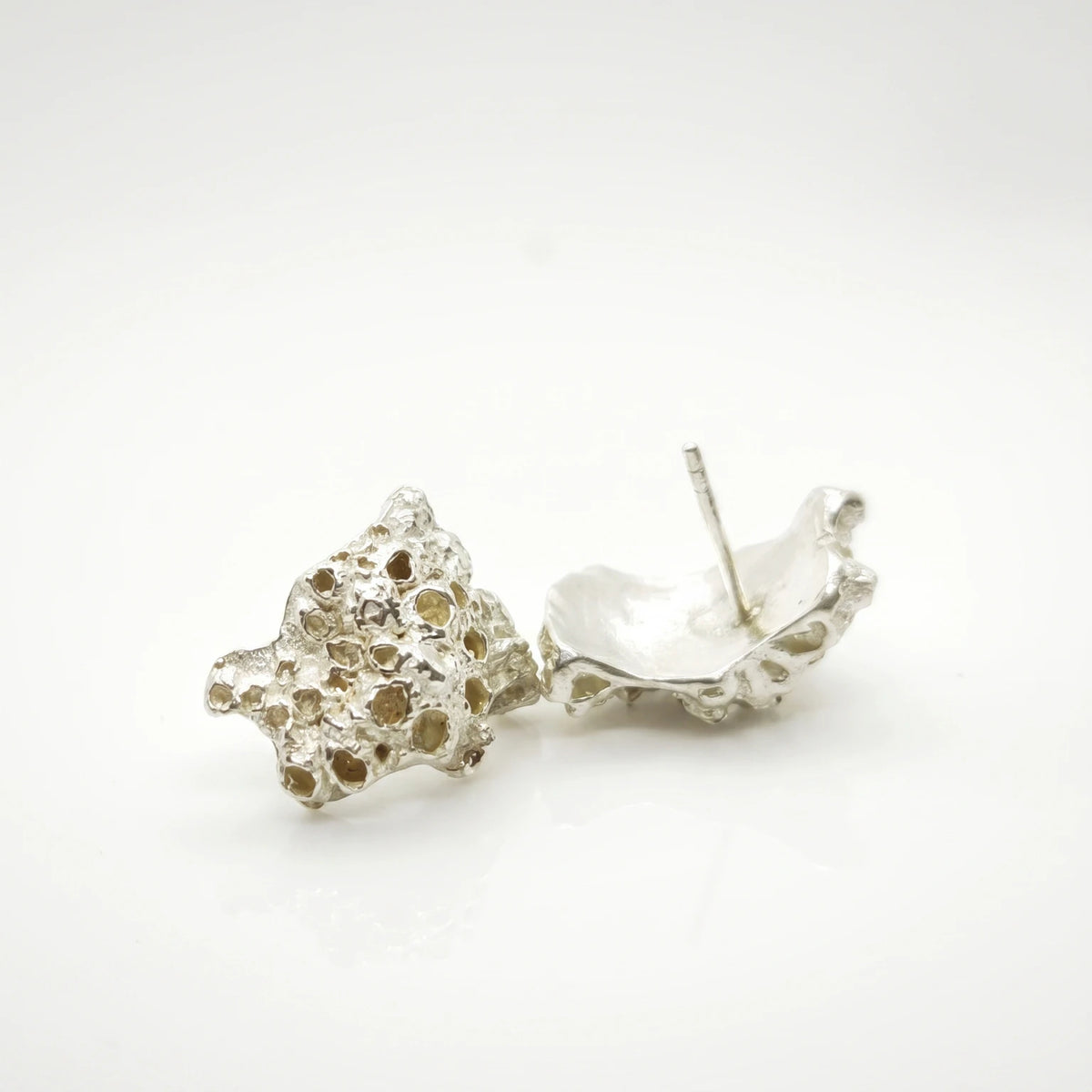 925 sterling silver earrings with the texture from a coraline. Design by Inês Almeida
