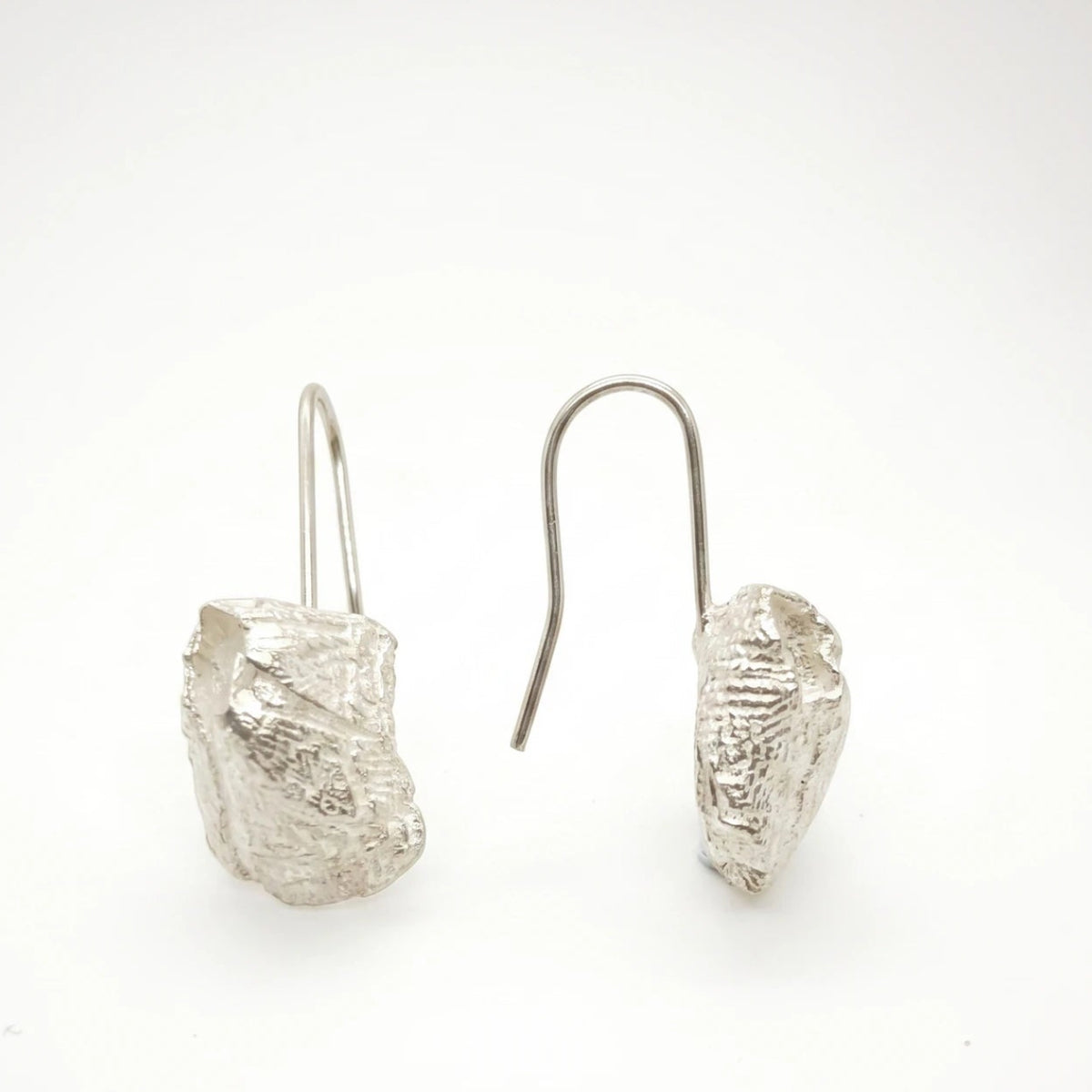 925 sterling silver earrings with the texture from a barnacle. Design by Inês Almeida