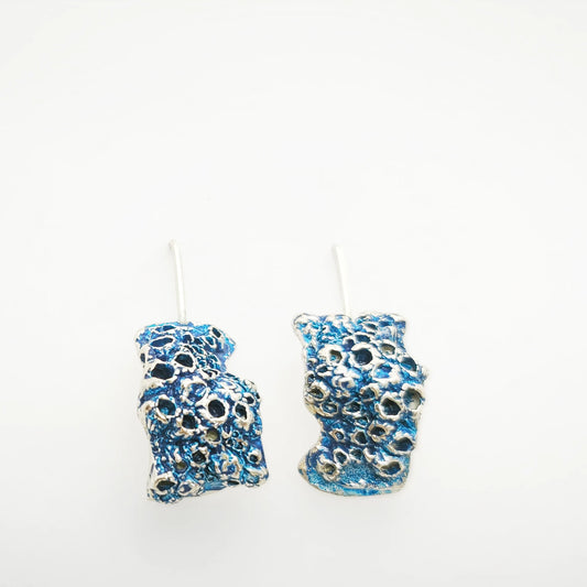 925 sterling silver earrings with the texture from a barnacle painted with blue. Design by Inês Almeida