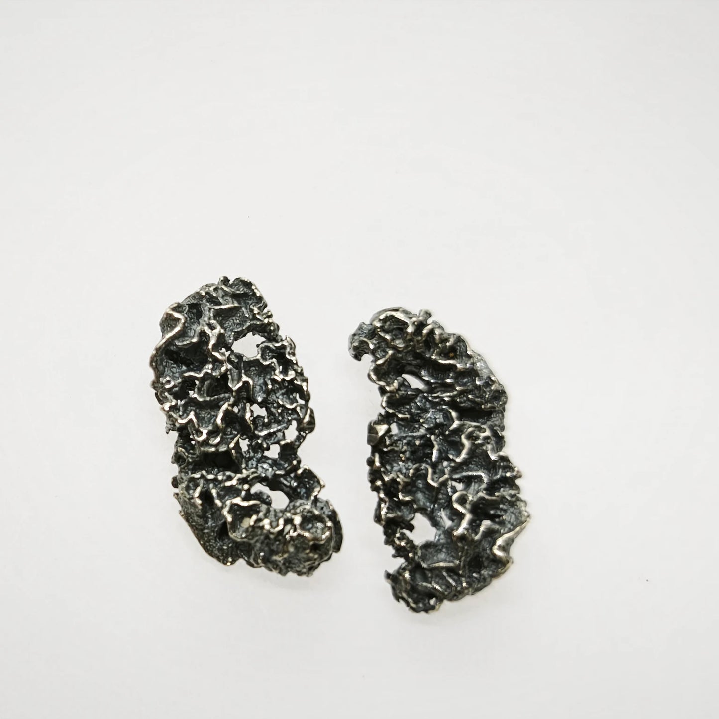 925 sterling oxidised silver earrings with the texture from a coraline. Design by Inês Almeida