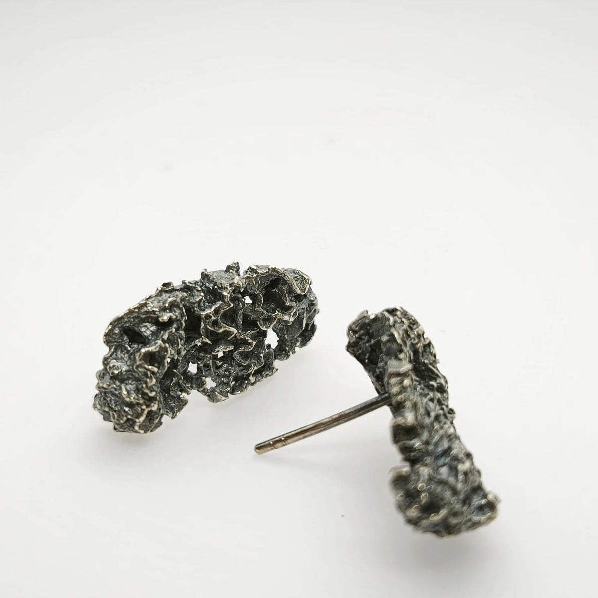 925 sterling oxidised silver earrings with the texture from a coraline. Design by Inês Almeida