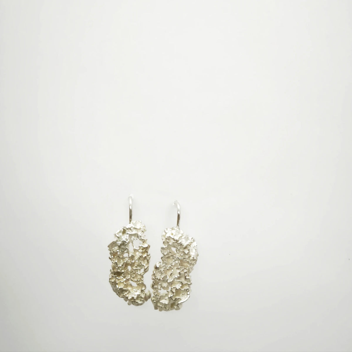 925 sterling silver earrings with the texture from a coraline. Design by Inês Almeida