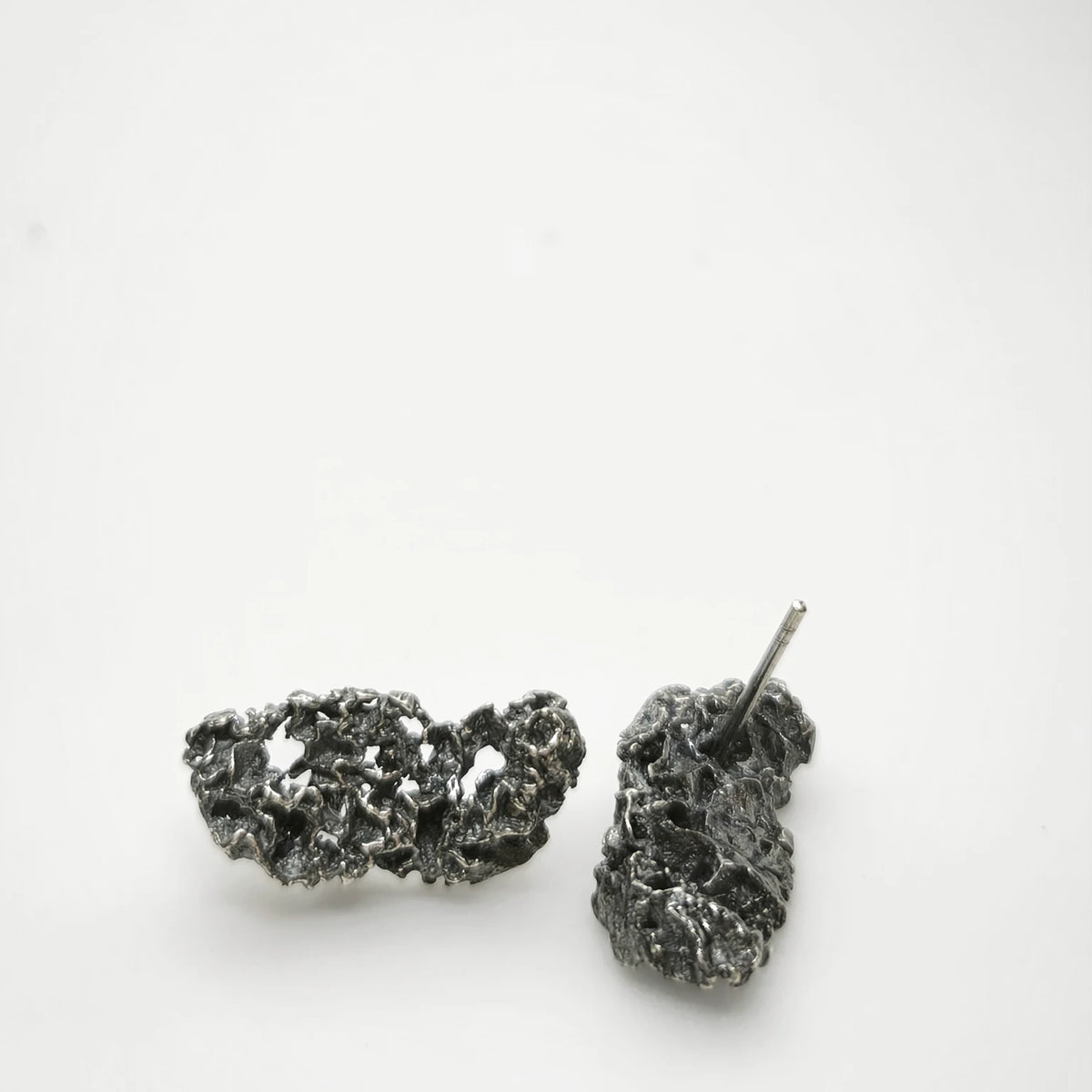 925 sterling oxidised silver earrings with the texture from a coraline. Design by Inês Almeida
