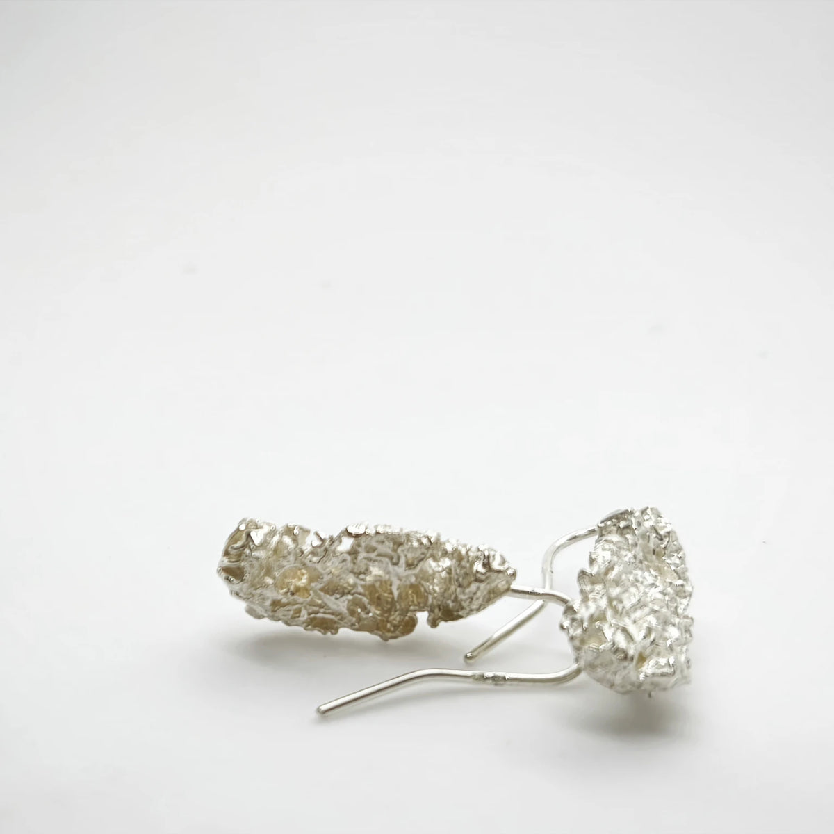 925 sterling silver earrings with the texture from a coraline. Design by Inês Almeida