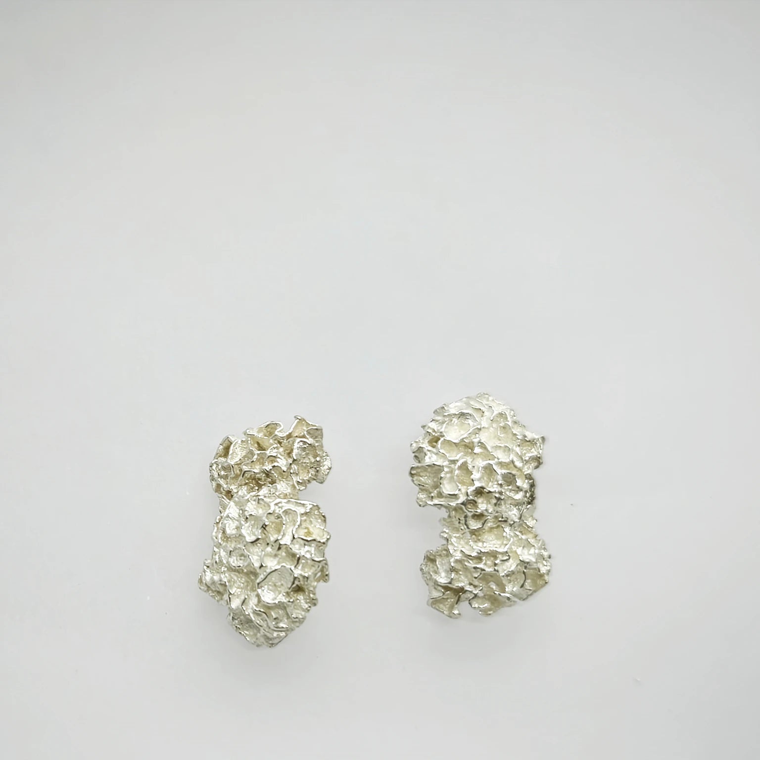 925 sterling silver earrings with the texture from a coraline. Design by Inês Almeida