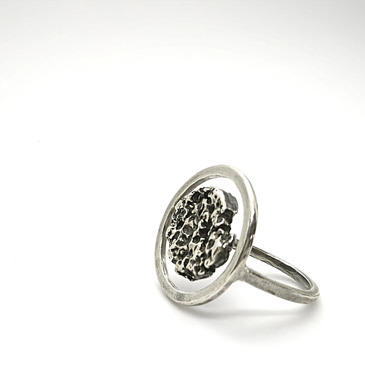 925 sterling silver ring oxidised with the texture from a conch shell. Design by Inês Almeida
