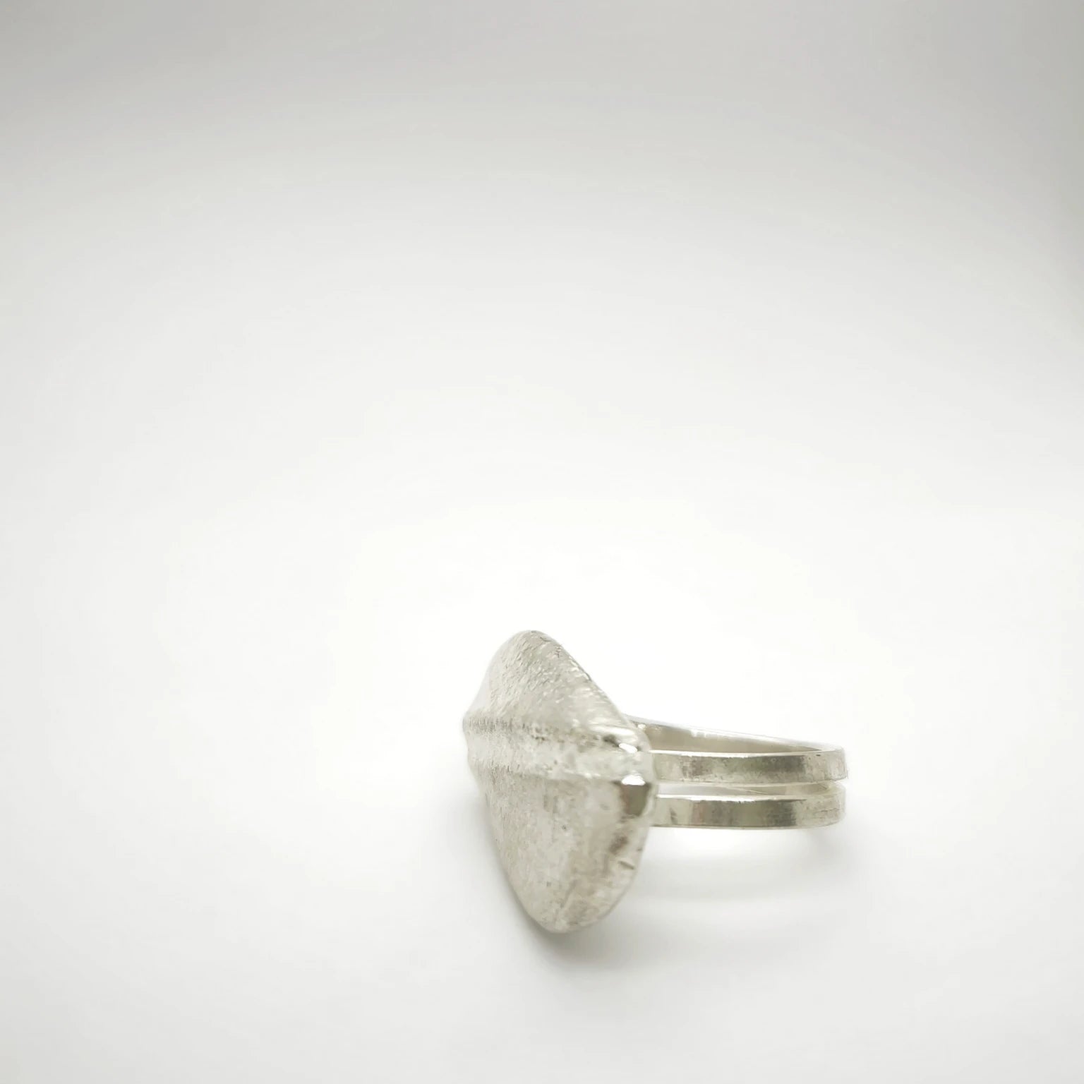 925 sterling silver ring with the texture from a pebble. Design by Inês Almeida