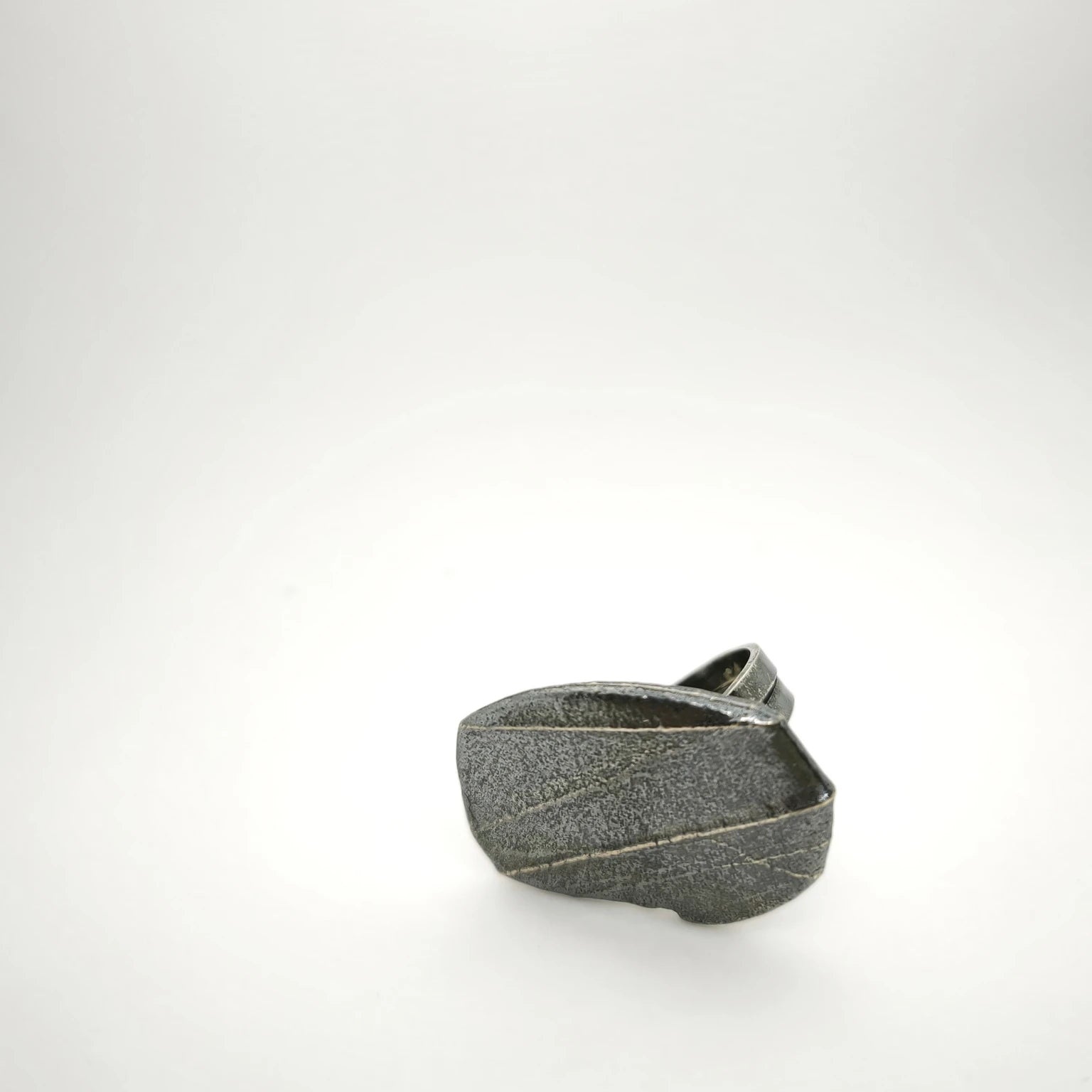 925 sterling silver oxidised ring with the texture from small pebble. Design by Inês Almeida