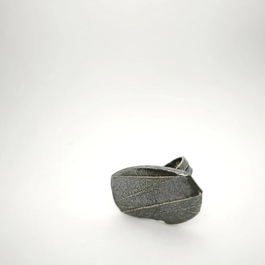 925 sterling silver oxidised ring with the texture from small pebble. Design by Inês Almeida
