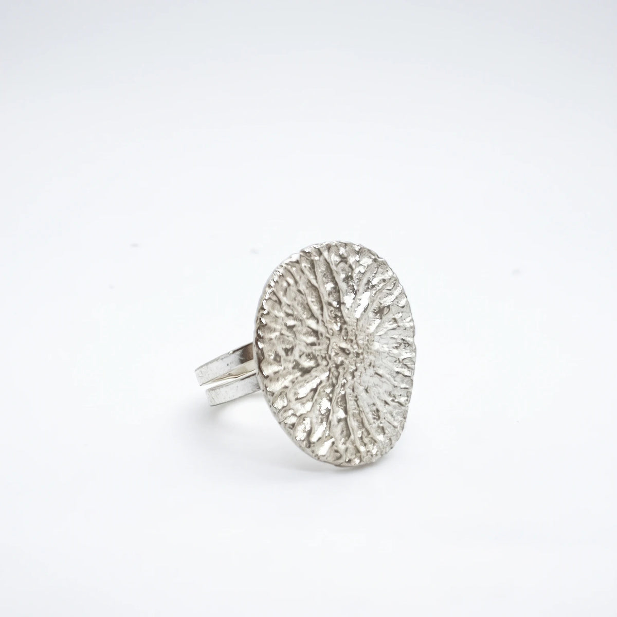 925 sterling silver ring with the texture from a dolphin bone. Design by Inês Almeida
