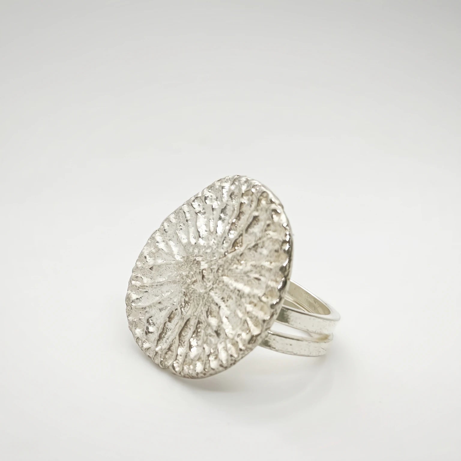 925 sterling silver ring with the texture from a dolphin bone. Design by Inês Almeida