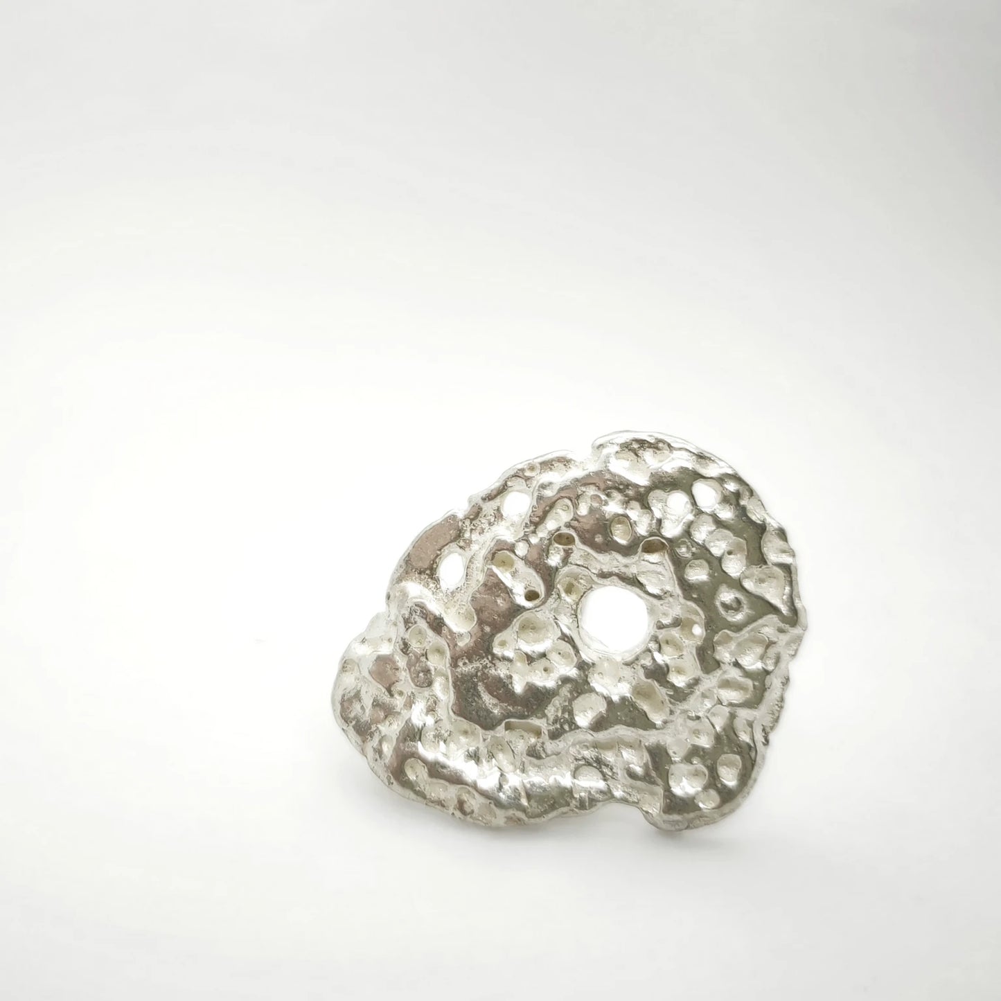 925 sterling silver ring with the texture from pebble. Design by Inês Almeida
