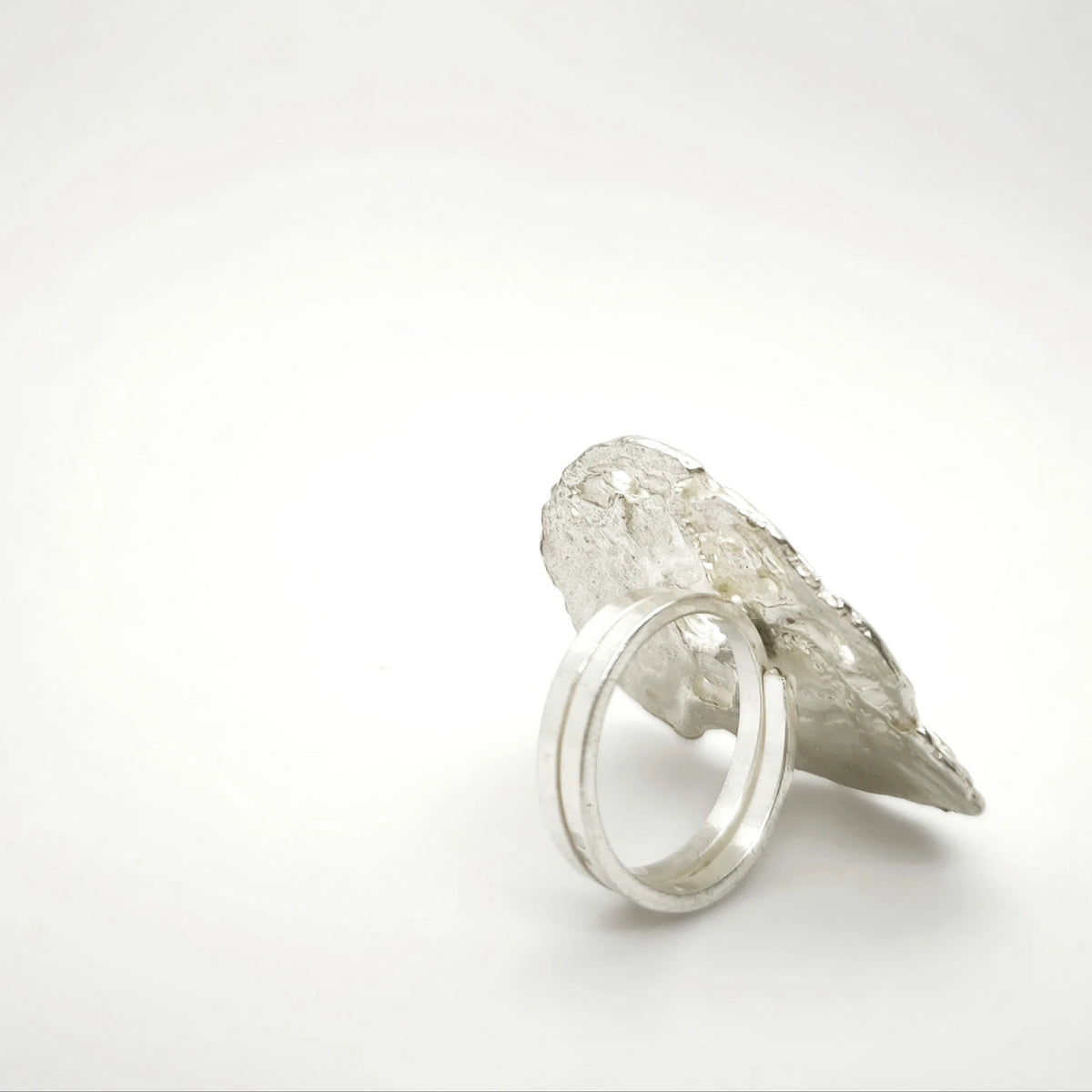 925 sterling silver ring with the texture from pebble. Design by Inês Almeida