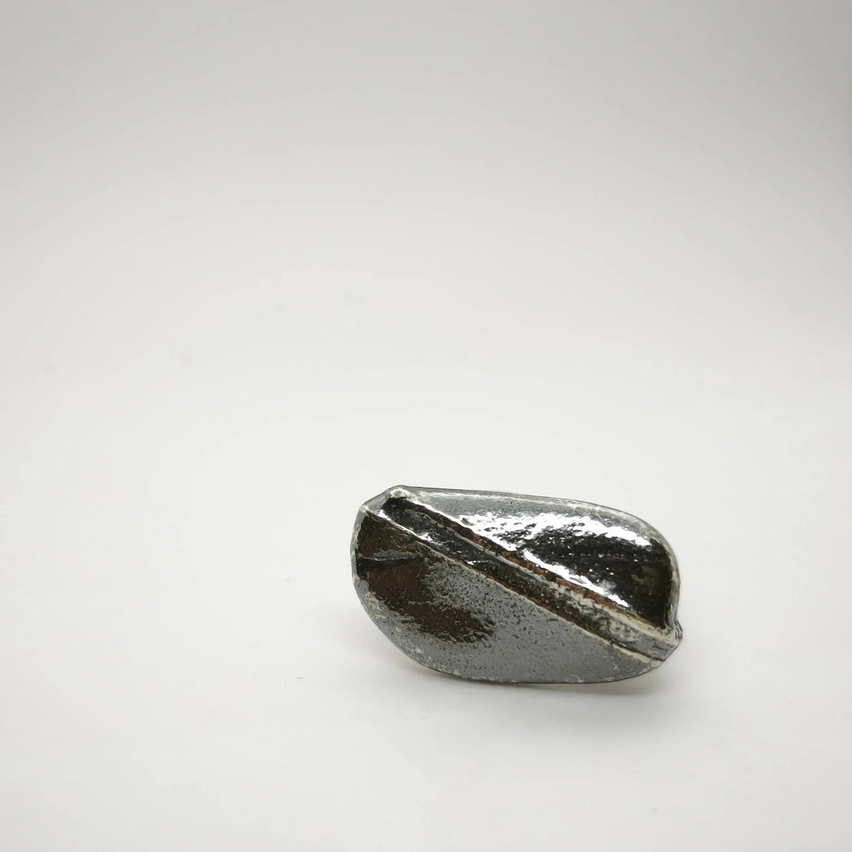 925 sterling silver oxidised ring with the texture from small pebble. Design by Inês Almeida