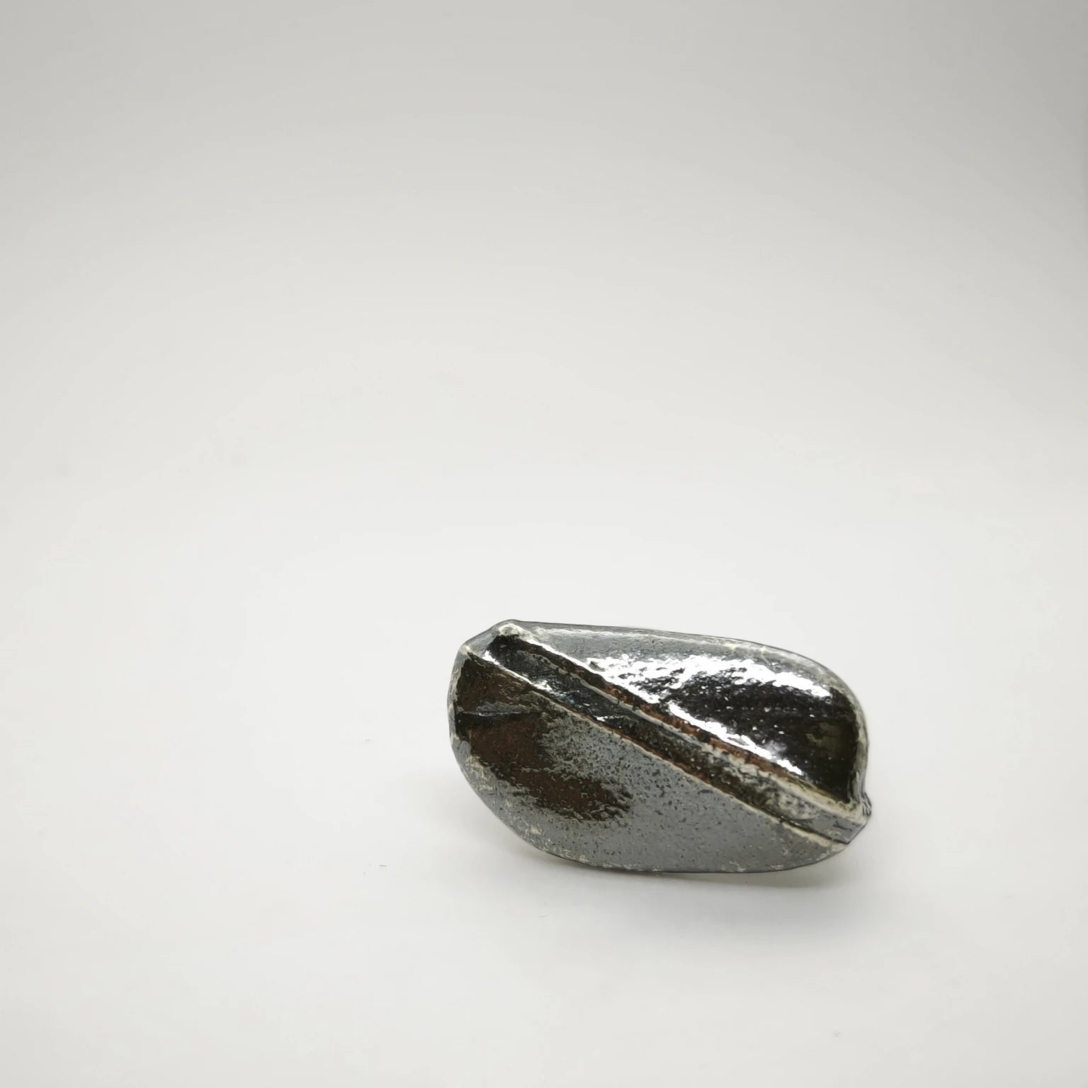 925 sterling silver oxidised ring with the texture from small pebble. Design by Inês Almeida