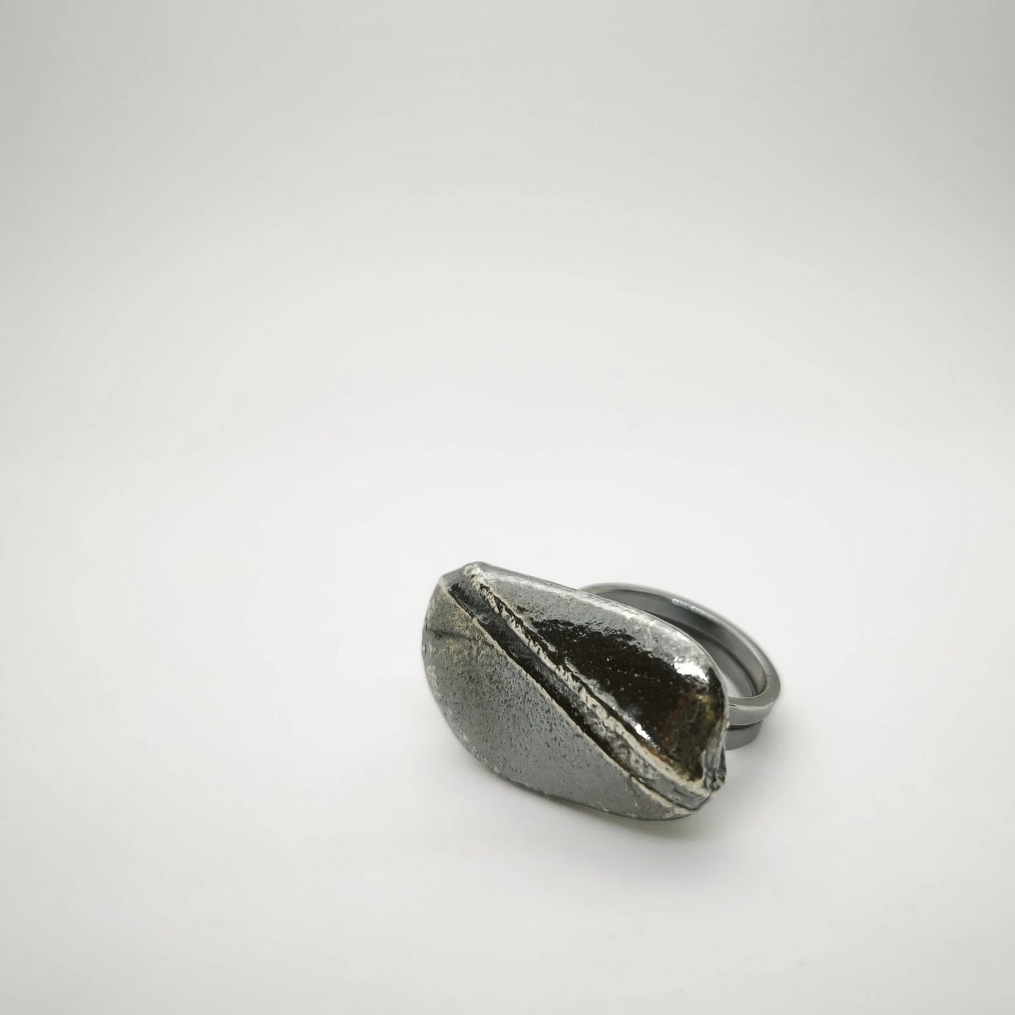 925 sterling silver oxidised ring with the texture from small pebble. Design by Inês Almeida