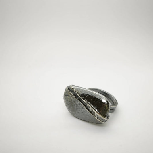 925 sterling silver oxidised ring with the texture from small pebble. Design by Inês Almeida