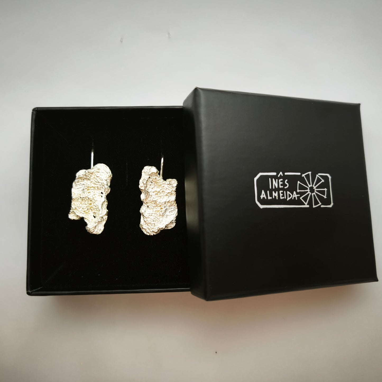 925 sterling silver earrings with the texture from an algae in a back jewellery box. Design by Inês Almeida