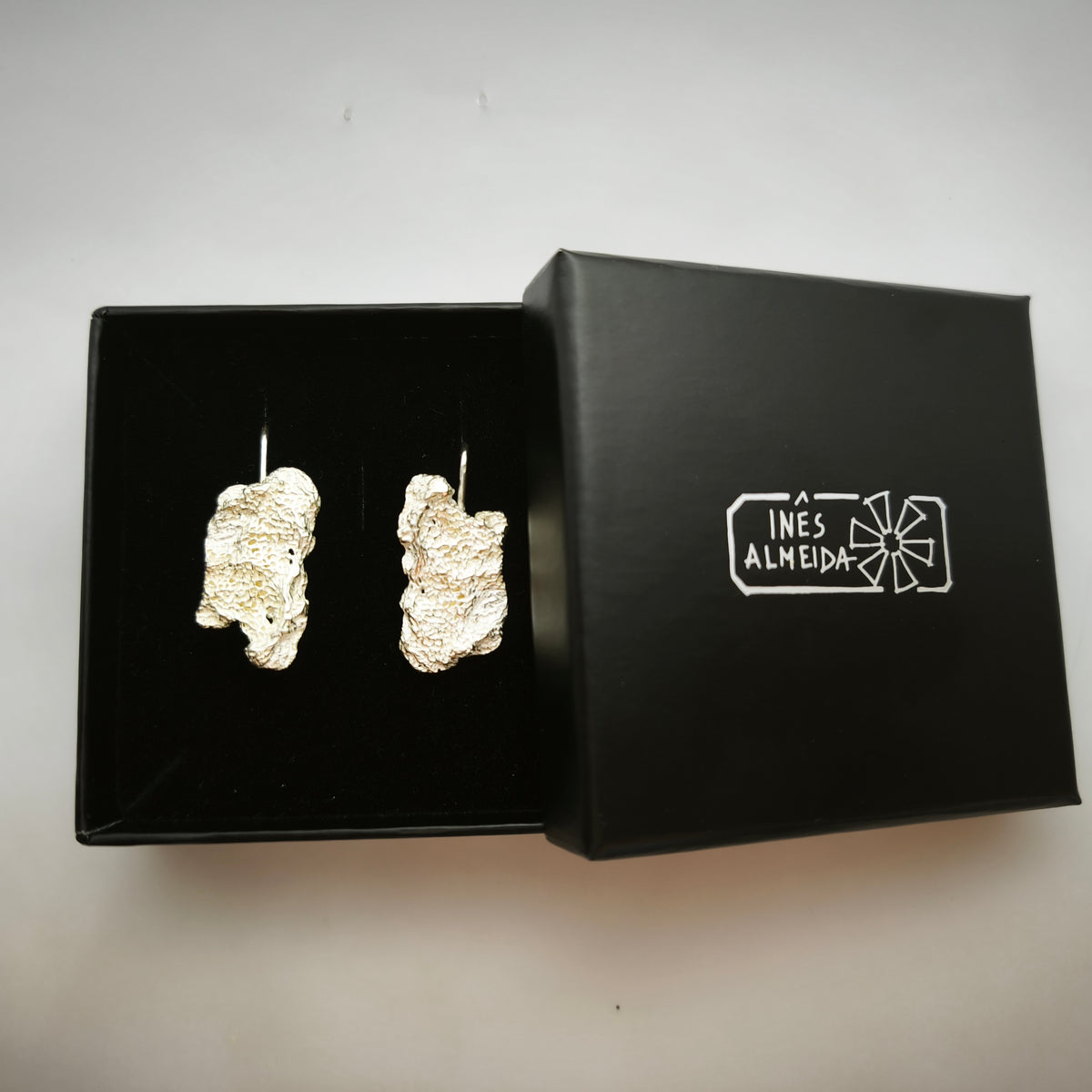 925 sterling silver earrings with the texture from an algae in a back jewellery box. Design by Inês Almeida