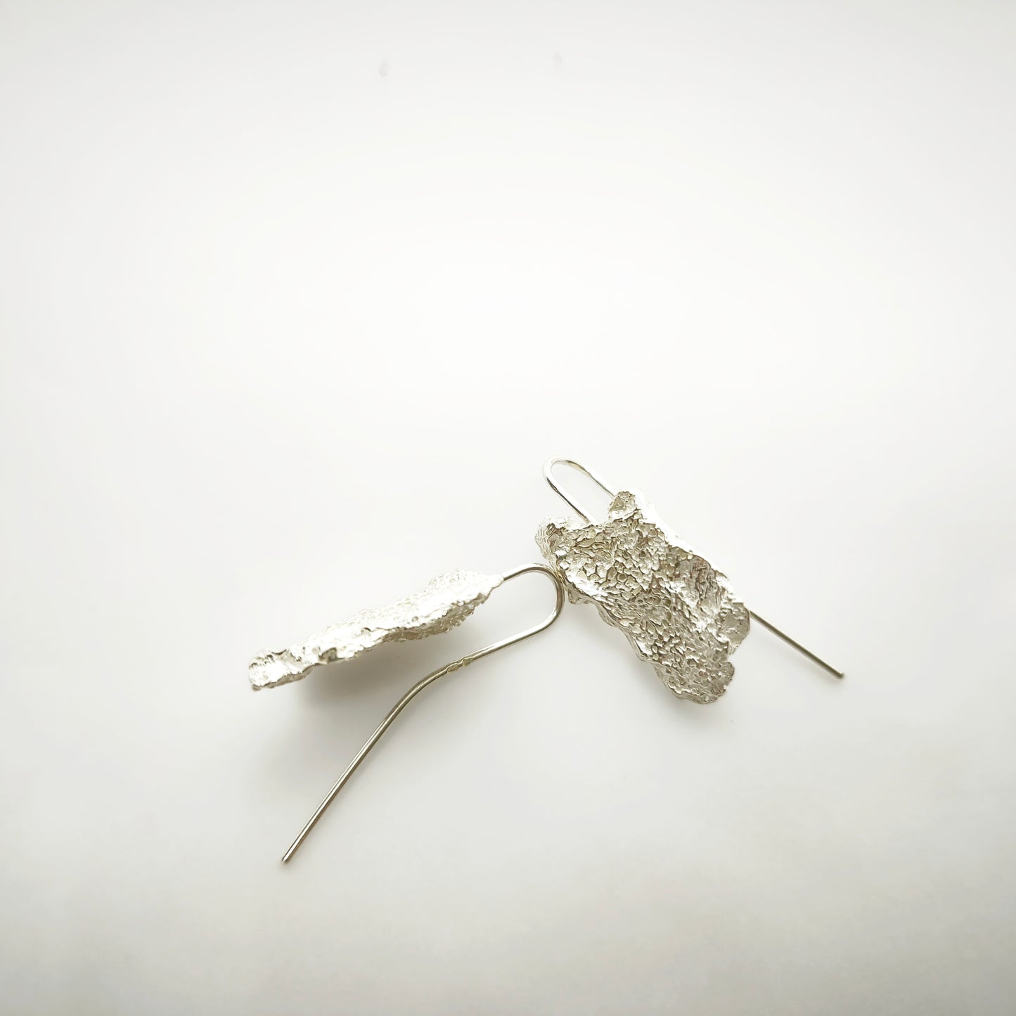 925 sterling silver earrings with the texture from an algae. Design by Inês Almeida